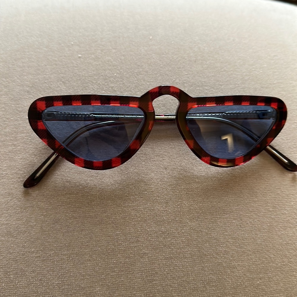Leandra Medine limited edition man repeller checkpoint sunglasses.